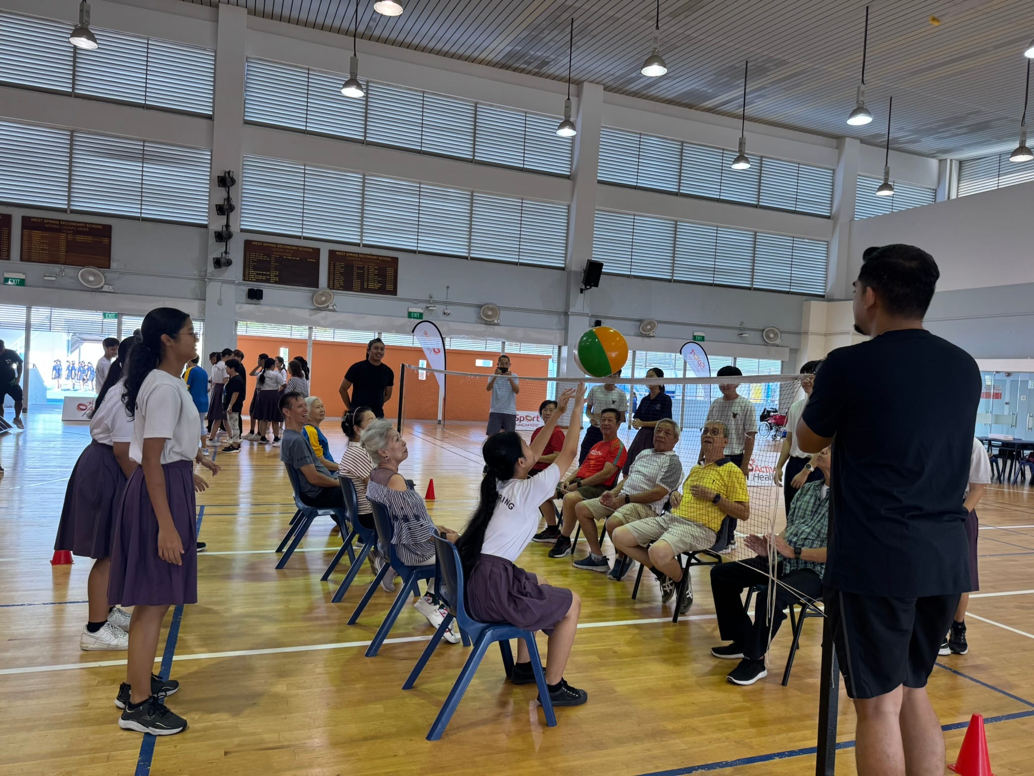 Students engaging seniors in various games in the community